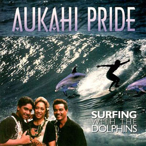 surfing with dolphin saukahi pride